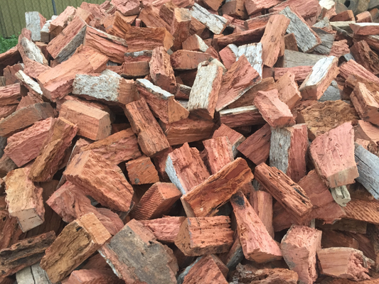 Betto’s Firewood. Mixed Species Split Hardwood Firewood. 800kg, 1000kg, 1500kg to 2000kg load sizes available. All load sizes delivered Free Lismore to Ocean Shores. 1500kg and 2000kg load sizes delivered FREE from Casino & Tweed, Northern Rivers NSW. Every load receives a Free Kindling & Free Firelighters. Picture of split Firewood block on a pile in the wood yard. Firewood Ballina, Bangalow, Byron Bay, Brunswick Heads, Alstonville, Clunes, Mullumbimby, Pottsville, Kingscliff, Murwillumbah, Evans Head)